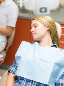 Woman resting comfortably because of dental sedation